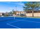 View of blue and green tennis court surrounded by community at 430 Zang St # 4-301, Lakewood, CO 80228
