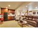 Finished basement featuring a seating area, wet bar, and a pool table in the background at 9164 E Lost Hill Trl, Lone Tree, CO 80124