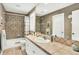 Bathroom featuring a tile shower/tub combo, sink, and vanity with a large mirror at 9164 E Lost Hill Trl, Lone Tree, CO 80124
