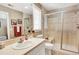 Bright bathroom featuring shower, sink, and toilet, with clean lines and a large mirror for a modern feel at 9164 E Lost Hill Trl, Lone Tree, CO 80124