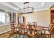 Formal dining room featuring decorative chairs, hardwood floors, decorative chandelier, and lots of space at 9164 E Lost Hill Trl, Lone Tree, CO 80124