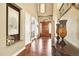 Elegant foyer features hardwood floors, soaring ceilings, and formal entryway at 9164 E Lost Hill Trl, Lone Tree, CO 80124