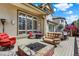 Cozy outdoor living space with comfortable seating, brick fire pit, and scenic views at 9164 E Lost Hill Trl, Lone Tree, CO 80124
