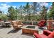 Inviting outdoor living space with a fire pit, comfortable seating, and serene garden views at 9164 E Lost Hill Trl, Lone Tree, CO 80124