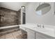 Bathroom with marbled shower backsplash and sink at 2101 S Victor St # C, Aurora, CO 80014