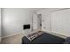 Bedroom with a bed, tv, closet, and door to the staircase at 2101 S Victor St # C, Aurora, CO 80014