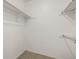 Empty closet with shelving on the walls at 2101 S Victor St # C, Aurora, CO 80014