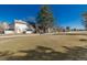 Scenic exterior view of a home near a green space with trees in the background at 2101 S Victor St # C, Aurora, CO 80014