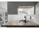 Cozy kitchenette featuring tiled countertops, stainless steel sink, and an open layout at 2101 S Victor St # C, Aurora, CO 80014