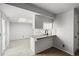 Well-lit kitchenette with ample counter space and direct access to the outdoor patio at 2101 S Victor St # C, Aurora, CO 80014