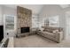 Bright living room showcasing a stone fireplace, vaulted ceiling and cozy seating arrangement at 2101 S Victor St # C, Aurora, CO 80014