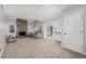 Open living area with a fireplace and seamless transition to the kitchen and dining spaces at 2101 S Victor St # C, Aurora, CO 80014