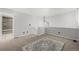 Neutral colored loft with overhead light and views of the bathroom at 2101 S Victor St # C, Aurora, CO 80014