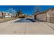 Outdoor pool with a safety cover and black metal fence for security and convenience at 2101 S Victor St # C, Aurora, CO 80014