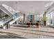 Bright common area with a staircase, large windows, and stylish furniture for residents to enjoy at 891 14Th St # 1506, Denver, CO 80202