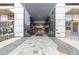 Modern building entrance with glass doors offering easy access to nearby shops at 891 14Th St # 1506, Denver, CO 80202