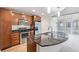 Stylish kitchen with stainless steel appliances, dark granite counters, and wood cabinets at 891 14Th St # 1506, Denver, CO 80202