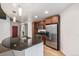 Open concept kitchen with stainless appliances, dark granite counters, and modern pendant lighting at 891 14Th St # 1506, Denver, CO 80202