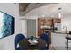 Cozy eat-in kitchen featuring stainless appliances, dark countertops, and stylish dining set at 891 14Th St # 1506, Denver, CO 80202