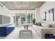 Bright living room featuring modern decor, large windows, and comfortable seating arrangement at 891 14Th St # 1506, Denver, CO 80202