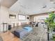 Spacious lounge area with comfortable seating, a projector screen, and a kitchenette at 891 14Th St # 1506, Denver, CO 80202