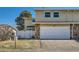 Exterior view of home with a two car garage and well maintained lawn at 2446 S Vaughn Way # A, Aurora, CO 80014