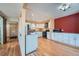 Spacious kitchen boasts granite countertops, white cabinets and stainless steel appliances at 2446 S Vaughn Way # A, Aurora, CO 80014
