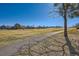 View of neighborhood open space with walking path and mature trees at 2446 S Vaughn Way # A, Aurora, CO 80014