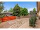Backyard features a garden with a pergola, along with a wood fence at 3806 S Dawson St, Aurora, CO 80014