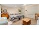 Bedroom with two twin beds, and a dresser with neutral walls and blinds on the windows at 3806 S Dawson St, Aurora, CO 80014