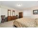 Bedroom with neutral walls, a large dresser, and bright, natural light coming from the window at 3806 S Dawson St, Aurora, CO 80014
