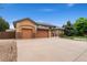 Charming home boasting a three-car garage, stone accents, and a spacious driveway at 3806 S Dawson St, Aurora, CO 80014