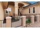 Inviting front entrance featuring a gated entry, stone accents, and manicured landscaping at 3806 S Dawson St, Aurora, CO 80014