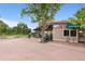 Golf shop exterior with golfers, golf course and large awning at 3806 S Dawson St, Aurora, CO 80014