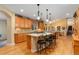 Open kitchen featuring a large island with a gas cooktop and bar stool seating, perfect for entertaining at 3806 S Dawson St, Aurora, CO 80014