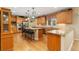 Well-equipped kitchen with stainless steel appliances, granite countertops, and custom cabinetry at 3806 S Dawson St, Aurora, CO 80014