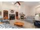 Cozy living room with fireplace, built-in shelving, and comfortable seating at 3806 S Dawson St, Aurora, CO 80014
