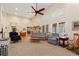 Spacious living room featuring tall windows, vaulted ceilings, and a neutral color palette at 3806 S Dawson St, Aurora, CO 80014