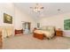 Spacious main bedroom with a ceiling fan, sitting area, ensuite access and a neutral color palette at 3806 S Dawson St, Aurora, CO 80014