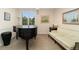 Formal music room featuring a grand piano, comfortable seating, and elegant decor at 3806 S Dawson St, Aurora, CO 80014