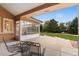 Covered patio with ceiling fan, outdoor furniture and view of landscaped backyard at 3806 S Dawson St, Aurora, CO 80014