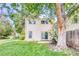 The backyard features traditional siding, mature trees, a well-maintained lawn and a concrete patio at 1519 S Sable Blvd # C, Aurora, CO 80012