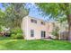 The backyard features traditional siding, mature trees, a well-maintained lawn and a concrete patio at 1519 S Sable Blvd # C, Aurora, CO 80012