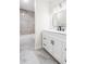 Stylish bathroom features a modern vanity, black fixtures, and a tiled shower/tub combo at 1519 S Sable Blvd # C, Aurora, CO 80012