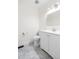 A half bathroom features tiled floors, toilet, and a single sink vanity at 1519 S Sable Blvd # C, Aurora, CO 80012