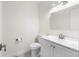 A half bathroom features tiled floors, toilet, and a single sink vanity at 1519 S Sable Blvd # C, Aurora, CO 80012