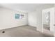 A bright, carpeted bedroom features a window and neutral walls at 1519 S Sable Blvd # C, Aurora, CO 80012