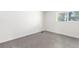 Bedroom featuring soft carpet and a view to the exterior at 1519 S Sable Blvd # C, Aurora, CO 80012