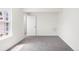 Bright bedroom with neutral carpet and a window for natural light at 1519 S Sable Blvd # C, Aurora, CO 80012