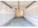 The garage is unfinished with a concrete floor and a door leading to the interior of the house at 1519 S Sable Blvd # C, Aurora, CO 80012